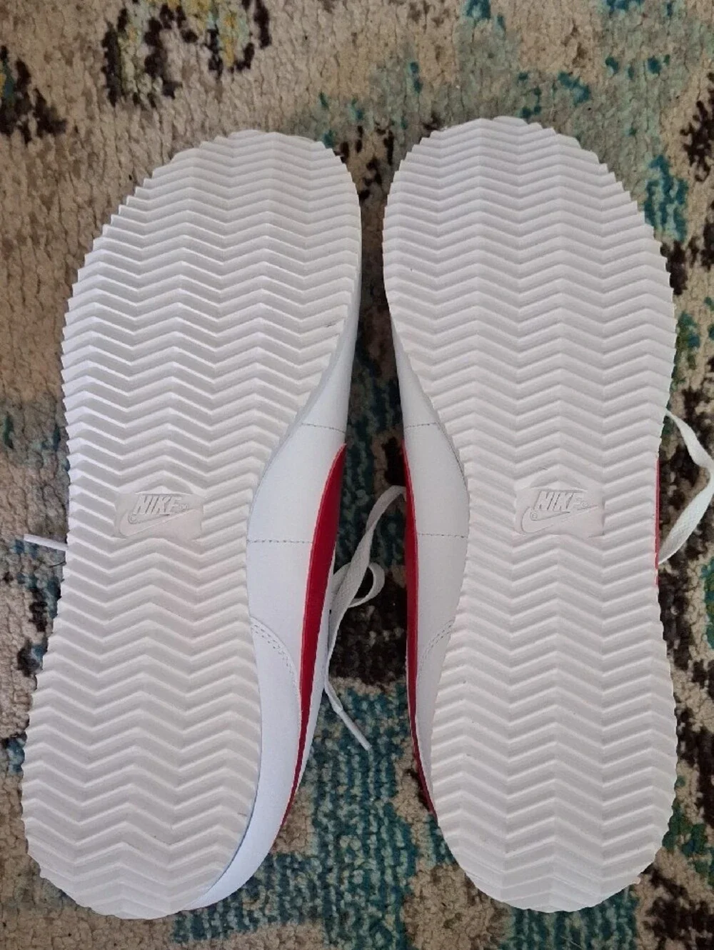 Nike White Sneakers with Red Swoosh and Blue Stripe